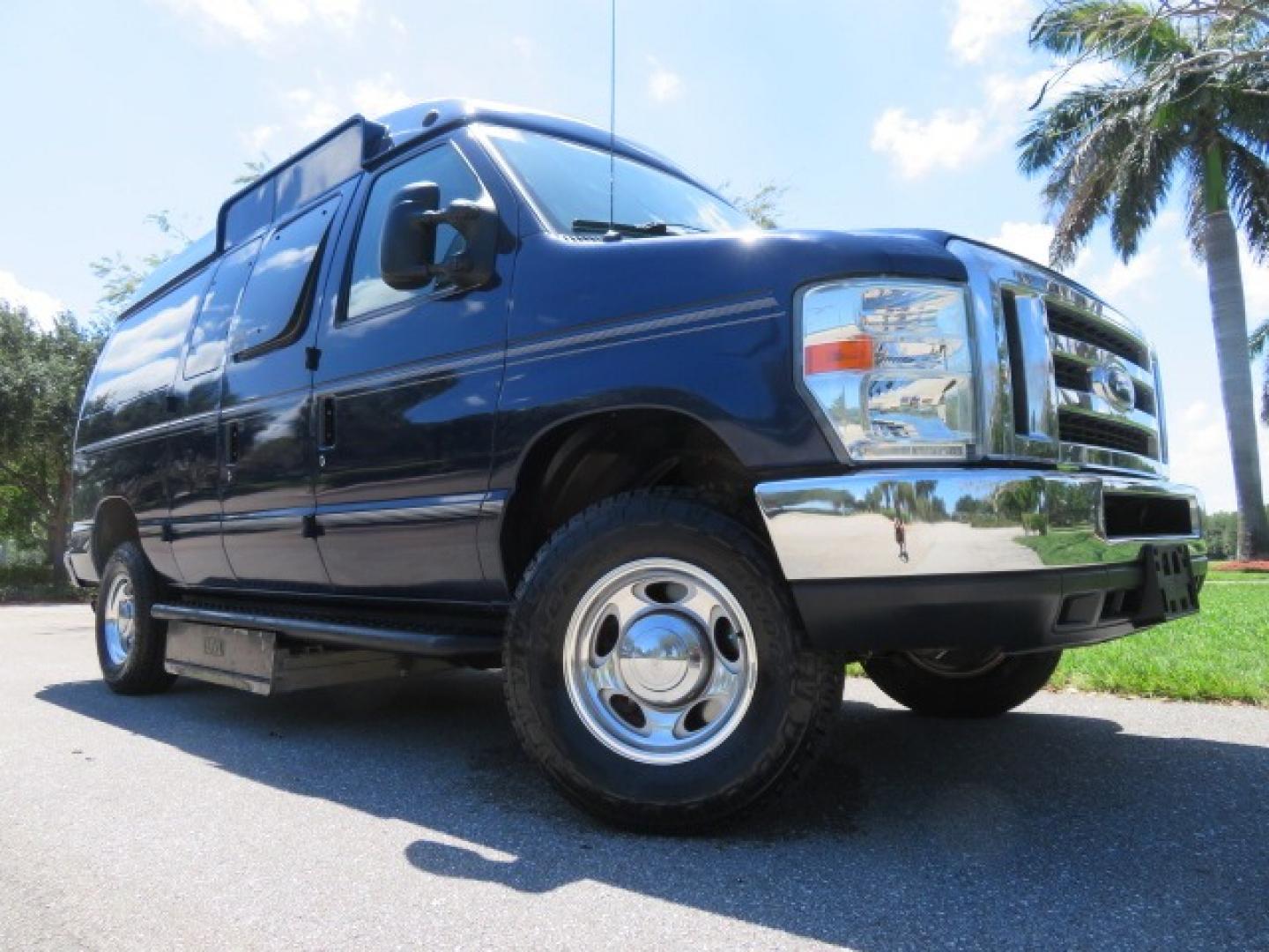 2011 Dark Blue /Gray Ford E-Series Wagon E-350 XLT Super Duty (1FBNE3BS4BD) with an 6.8L V10 SOHC 20V engine, located at 4301 Oak Circle #19, Boca Raton, FL, 33431, (954) 561-2499, 26.388861, -80.084038 - You are looking at a Gorgeous 2011 Ford Econoline E350 XLT Norcal Max High Top Handicap Wheelchair Conversion Van with 6.8L V10, 15K Original Miles, 9 Inch Lowered Floor, Braun UVL Side Entry Wheelchair Lift, Remote Control Power Side Entry Doors, Expanded Side Entry Doors, Q Straint Tie Down, Syste - Photo#2